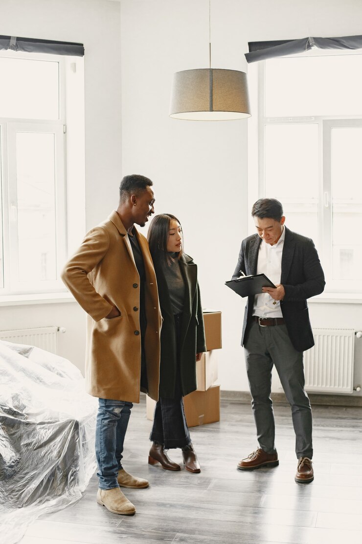 Real estate agent discussing neighborhood details with clients